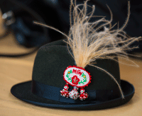 Folk crafts: Black hat with ornament and árvalányhaj (feathery plant) at the Smithonsian's Folklife Festival in 2013